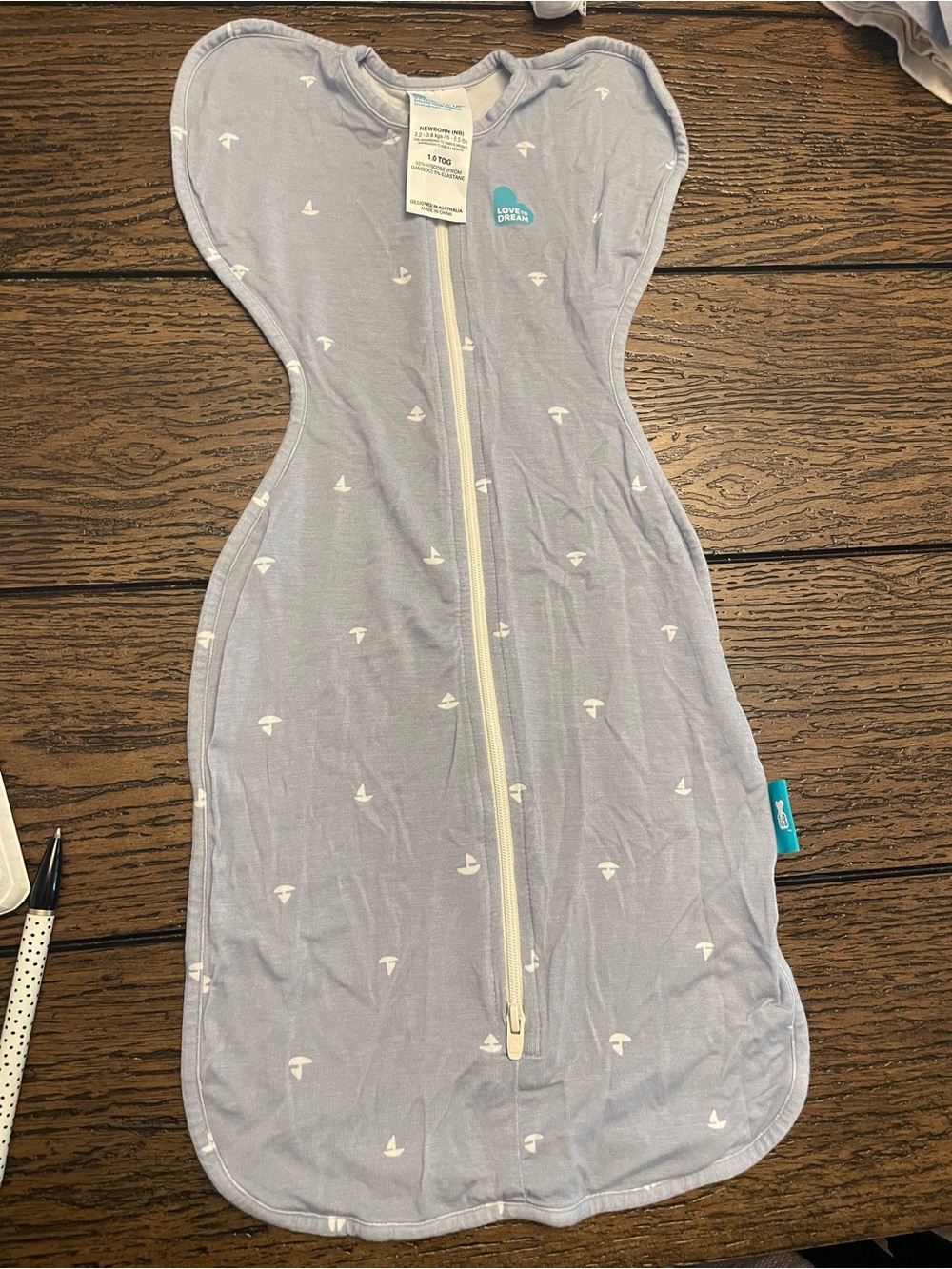 Love to Dream light blue swaddle sleep suit with white sailboat print